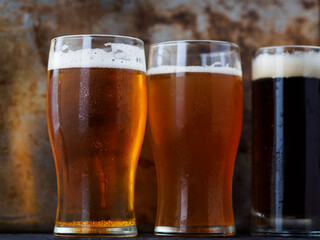 Three beers on the table. Various draft beer