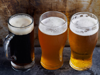 Three beers on the table. Various draft beer