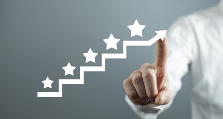 Male hand showing 5 stars on stairs. Increase rating
