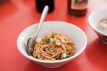 Yamin chicken noodles (Mie Yamin), a typical Indonesian street food.