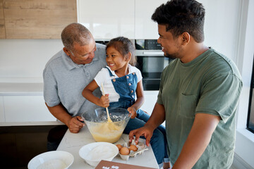 Family, love and cooking with a girl, father and grandfather baking together in the kitchen of...