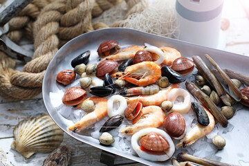 Mediterranean, raw seafood mix on a metal plate, top view. Marine composition, selective focus....