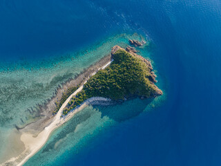 High angle aerial drone view of Langford Island, a small islet next to Hayman Island, a luxury...