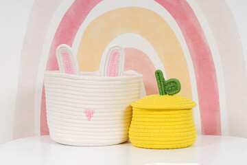 Storage Baskets on the table in children's room. Cloth stylish Baskets. Organizing and Storage Ideas. House cleaning.