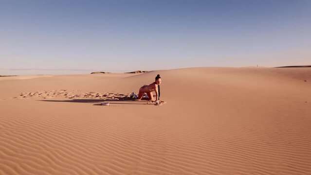 Drone To Woman On All Fours In Bikini In Desert