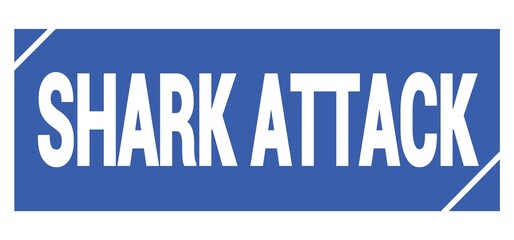 SHARK ATTACK text written on blue stamp sign.
