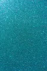 Background with sparkles. Backdrop with glitter. Shiny textured surface. Vertical image. Dark cyan