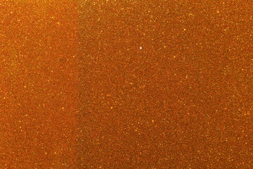 Background with sparkles. Backdrop with glitter. Shiny textured surface. Dark orange Brown tone