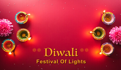 Happy Diwali - Clay Diya lamps lit during Diwali, Hindu festival of lights celebration. Colorful...