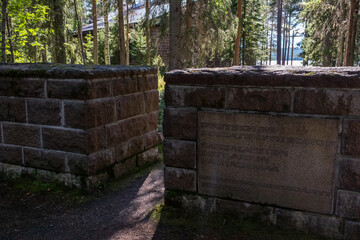 Fototapeta premium Norvajarvi, Rovaniemi Finland - August 8, 2022: German military cemetery in Norvajarvi was used to bring together the war graves in the northern part of Finland. Summer sunny day. Selective focus