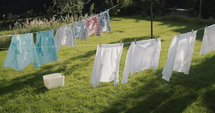 Wet clothes drying in the backyard of the house. Top view