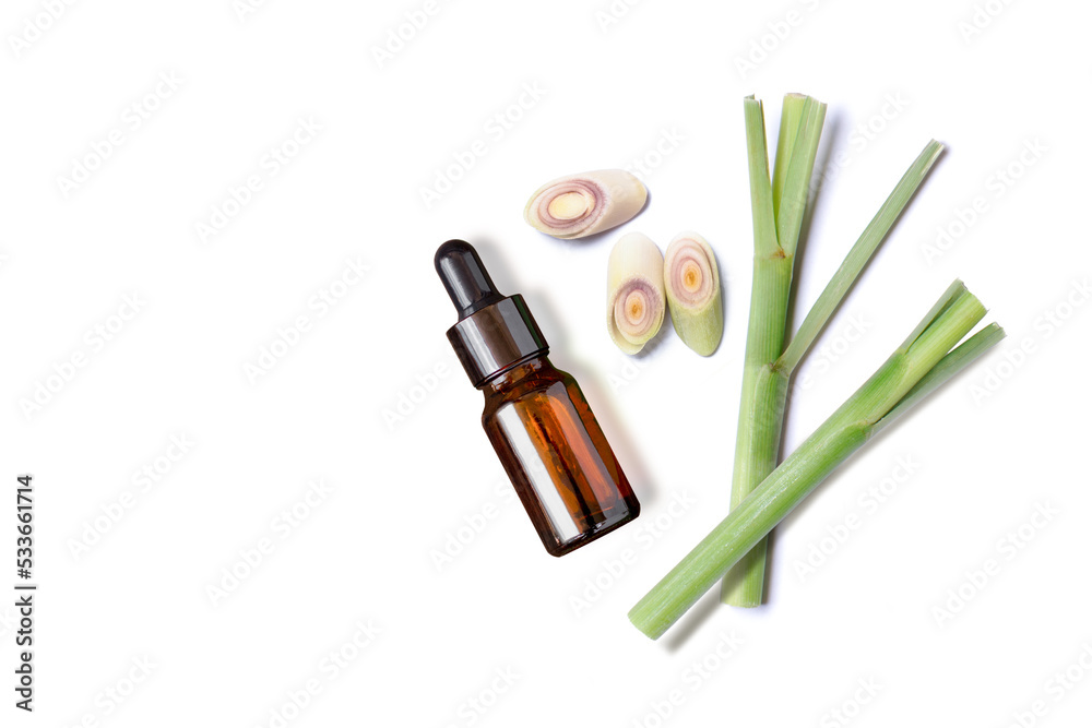 Wall mural Lemongrass essential oil with lemon grass slice isolated on white background. Top view. Flat lay. - Wall murals
