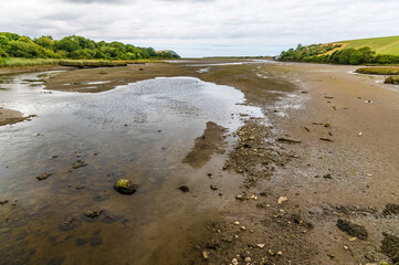 A close up view of the River Nevern estuary at low tide near Newport, Pembrokeshire, Wales on a...