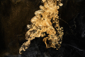 Golden sparkling abstract background, luxury black smoke, acrylic paint underwater explosion, cosmic swirling ink