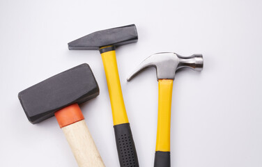 Different construction hammers isolated on white background close-up