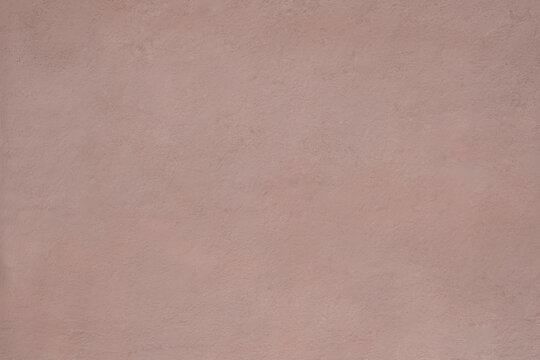 Blank old plastered wall dusty pink color