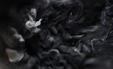 Black gray smoke abstract background, acrylic paint underwater explosion, swirling ink