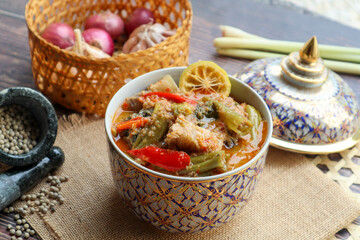 Thai red curry with morning glory and pork belly - Authentic Thai food called Kang Tay po served in Benjarong porcelain