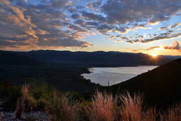 View of Trichonida lake at dusk in Aetolia-Acarnania. - obrazy, fototapety, plakaty