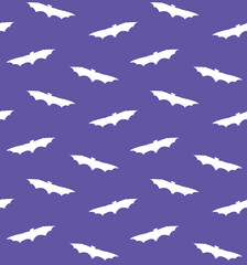 Vector seamless pattern of hand drawn flying bat silhouette isolated on violet background