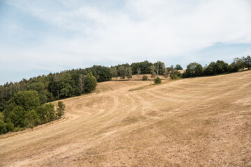 Extremely dry mowed agricultural field in Ore Mountains 