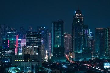 Fototapeta na wymiar Night city view of business district with skyscrapers in Manila, Philippines