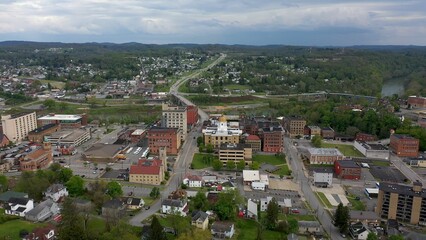 Fototapeta na wymiar Wide angle view of the Marion County courthouse in Fairmont, WV, and the surrounding small town river and countryside in the appalachian mountains.