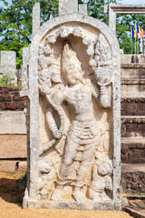 Guard stone in Thuparama temple entrance, naga raja and two dwarfs carved in one stone.