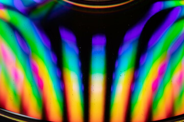 Drops of water on a CD create an explosion of color
