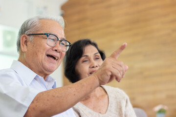 Nursing Home Care concept. elderly couple asian woman are sitting together happily.