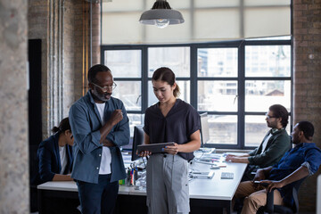 Business owner looking at planning strategy on a digital tablet