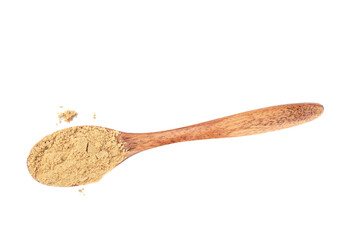 Powder of ground ginger on a wooden spoon over a white background.