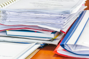 There are folders with technical documentation of engineering gas supply systems for cottages in private sector on ffice table.