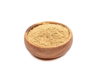 Wooden bowl with ground ginger root powder over white background.