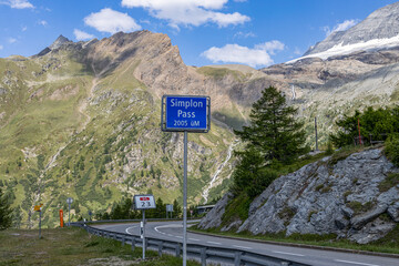 SIMPLON PASS, SWITZERLAND, JUNE 20,2022 - Signpost at the Simplon pass. It is an alpine pass with an altitude of 2005 metres located in Switzerland, in the canton of Valais.
