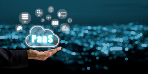 PaaS - Platform as a service, Businesswoman hand holding Paas icon on VR screen with blue bokeh background, Internet technology and development concept.