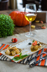 Wine and fish dish in restaurant halloween