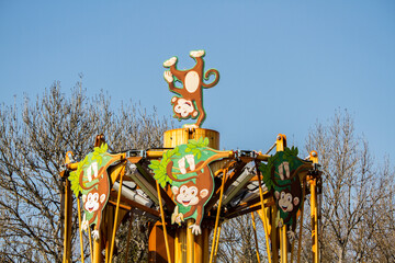 Traditional carousel / roundabout with monkeys (fun and childhood)