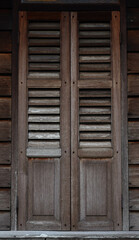 Obraz na płótnie Canvas an old wooden window of a Malay house