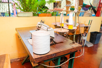 Craft sewing workshop in Latin America, sewing machine, threads and other elements