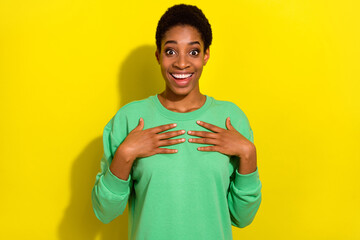Photo of attractive funky trans person dressed green sweater arms chest isolated yellow color...