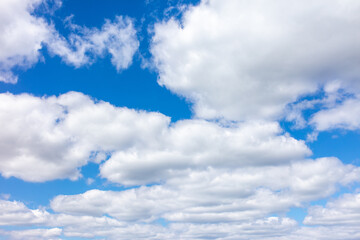 White clouds against the blue sky.