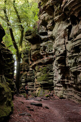 Rock formation and woodland landscape inside the Luxembourg little Switzerland (Mullerthal) region near the German border