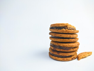 a stack of Sandwich biscuits, filled with chocolate, isolated on white background 