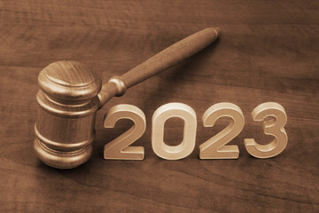 Wooden judge gavel with numbers 2023. Concept of court in year 2023. - obrazy, fototapety, plakaty