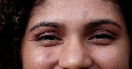 Hispanic woman eyes macro close-up. Latina opening and closing eye smiling
