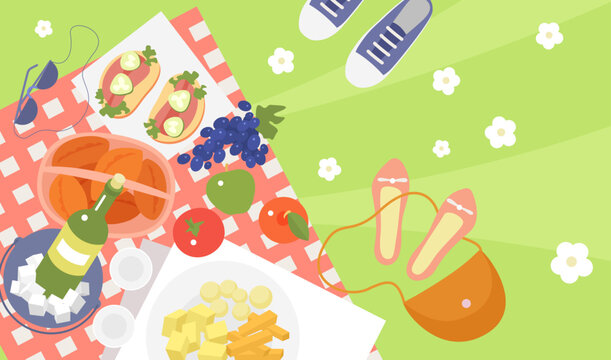 Picnic food, top view vector illustration. Cartoon weekend lunch in summer or spring garden, wine bottle and cheese, fruit and sandwiches on checkered tablecloth, outdoor picnic party background