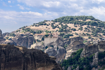 Fototapeta na wymiar The monasteries are built on rock pinnacles of deltaic origin, called Meteora, rising over 400 m above the Thessalian plain, Greece, religious travel in Europe