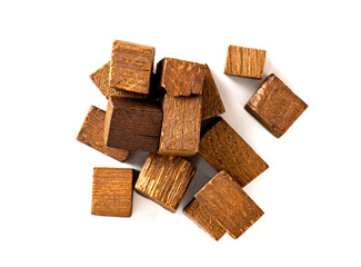 Smoked oak chips for home brewing. Wooden smoked blocks isolated on white background. Wood chips for home brew beer and wine making.