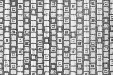 Closeup shot of a gray square patterned fabric textile surface